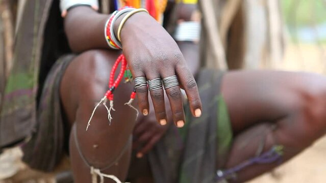 Hand with rings of an Erbore tribe woman Omo valley Murale Ethiopia