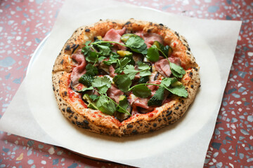 Pizza with roast beef and cilantro