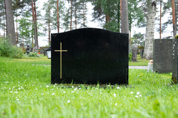 blank black colored gravestone at cemetery
