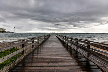 Fototapeta na wymiar View at lake constance (Bodensee) at a stormy and rainy day, from Bregenz, Austria