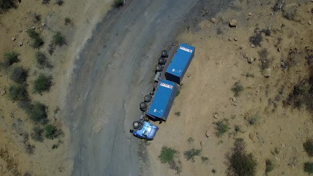 Aerial view of a truck overturned on a mountain roadOmo ValleyKonso Ethiopia