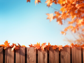 フェンスの向こう側に紅葉したモミジの葉と青空背景。さわやかな秋晴れ。生成AI