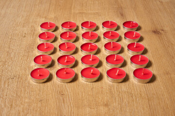 Red tealight candles on a table.