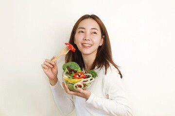 woman holding a bowl of salad