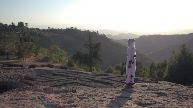 Ethiopian woman in front of the church of st. George Lalibela Ethiopia