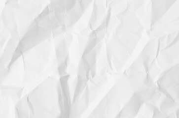 Creative background with scattered overlay of crumpled white paper.	