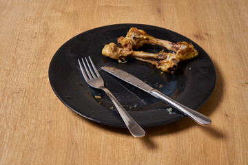 Chicken left over bones on a plate
