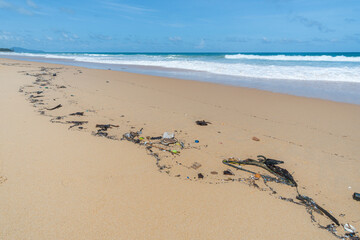 Beach pollution. Lots of Trash, plastic bottles and litter on the coastline