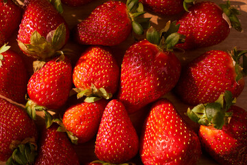 Fresh and juicy organic strawberries on chefs table.