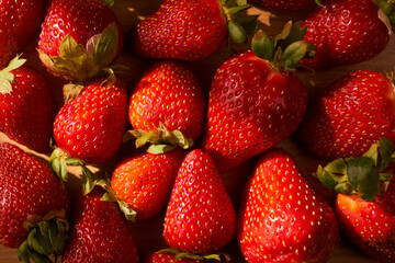 Fresh and juicy organic strawberries on chefs table.