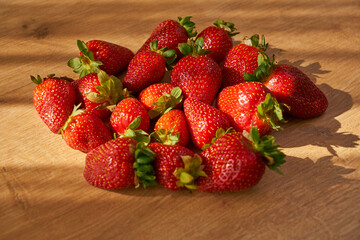 Fresh and juicy organic strawberries on chefs table.