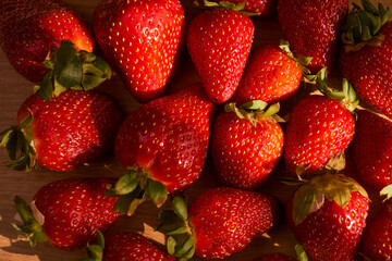Fresh and juicy organic strawberries on chefs table.
