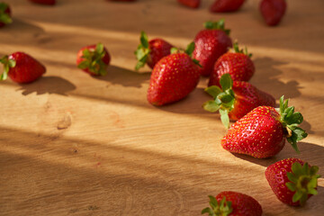 Fresh and juicy organic strawberries on chefs table.