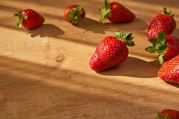 Fresh and juicy organic strawberries on chefs table.