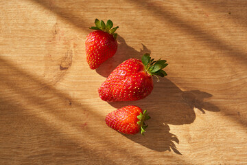 Fresh and juicy organic strawberries on chefs table.