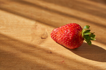 Fresh and juicy organic strawberries on chefs table.