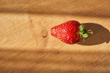 Fresh and juicy organic strawberries on chefs table.