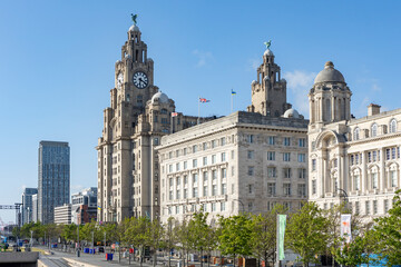 Fototapeta premium Liverpool, united kingdom May, 16, 2023 Pier Head and The Three Graces, consist of the Royal Liver Building, The Cunard Building and the Port of Liverpool Building