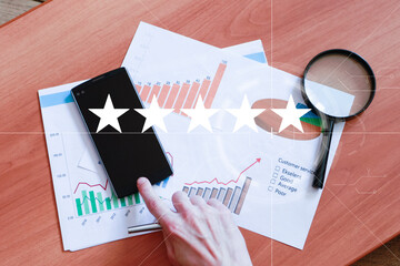 Businessman hand arranging button with sign 5 star rating or review in survey on the diagram. - 632524295