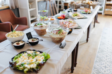 Buffet with salads, meats, and cheeses at a German wedding reception