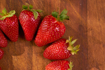 Fresh and juicy organic strawberries on chefs table.