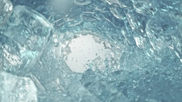 Super Slow Motion Shot of Clear Water and Ice Cubes Rotating in Wave at 1000fps.
