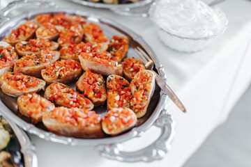 Delicious bruschetta on a silver tray at a wedding buffet