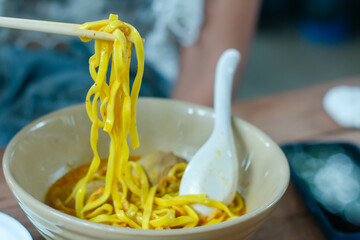  Khao Soi, Soft focus bowl of Beef Northern Thai noodle based with coconut milk and chili paste