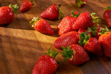 Fresh and juicy organic strawberries on chefs table.