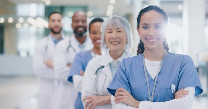 Crossed arms, success and face of group of doctors standing in the medical hospital with confidence. Happy, professional and portrait of team of healthcare workers in hallway of a medicare clinic.