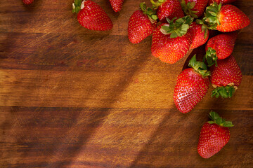 Fresh and juicy organic strawberries on chefs table.