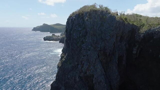 Coastline and cliffs of Cabo Cabron national park In Samana, Dominican Republic. Aerial drone forward view