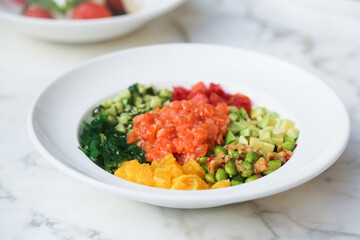 Traditional salmon poke with fresh orange
