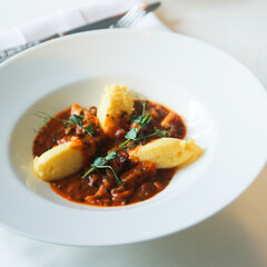Traditional polenta served with tomato sauce
