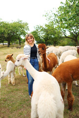 A girl having fun with lama © Olga