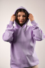 woman wears a plain hoodie. Clothes mockup for logo and branding