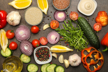 cooking background, home cooking concept. Ripe vegetables, herbs and spices on a dark background, top view, copy space.