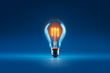 Isolated classic light bulb shining on blue background. Energy saving concept.