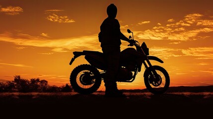 Fototapeta na wymiar Man wearing hat on off road motorbike at dusk