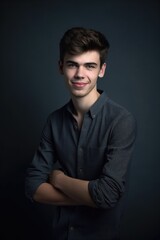 Fototapeta premium studio shot of a young man posing against a gray background