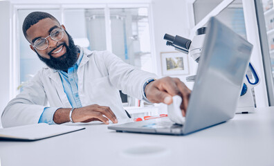 Fototapeta na wymiar Wiping keyboard, research and a scientist or man in a lab, working and disinfectant for a laptop. Happy, healthcare and a doctor or an employee cleaning a computer of a virus for medical safety