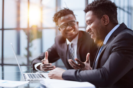 African American Boss Negotiating Discussing Contract Details With Company Corporate Client.