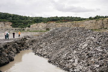 carrying out work in a quarry where minerals are extracted with the help of excavations, explosive works