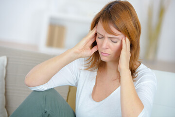 a woman having a headache
