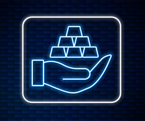 Glowing neon line Gold bars in hand icon isolated on brick wall background. Banking business concept. Vector
