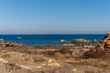 Cap de Creus Alt Emporda, Spain. February 2023 Rugged rocky coastline with turquoise waters in contrast. Sharp rocks extend out to the sea, creating a dramatic and wild texture.