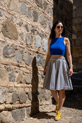 Young woman tourist enjoying and exploring the medieval city of Toledo in Spain