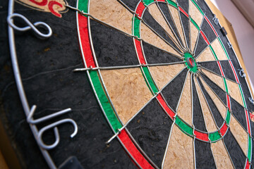 Professional dart game. Arrows and dart table. Pub games.