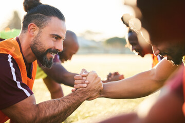 Rugby, shaking hands and team exercise, training or cooperation at sunrise. Handshake, sports...