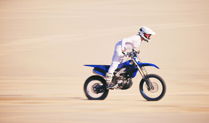 Race, motorbike and person in desert, action and extreme sport with speed, riding outdoor and mockup space. Adventure, fitness and training, motorcycle exercise and freedom, challenge and performance